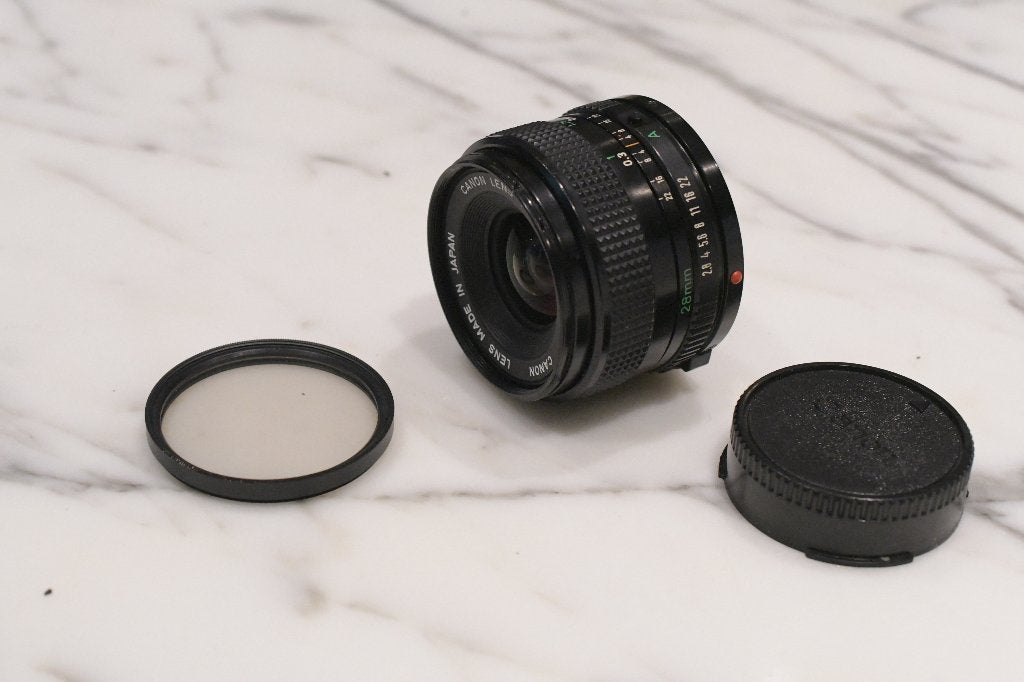 Canon 28mm/f2.8 FD met Skylightfilter 1A, Ophalen of Verzenden, 1980 tot heden, Lens of Lenzen