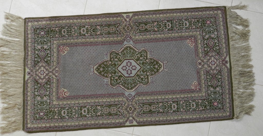 Tapis oriental Alloucha de Kairouan, Enlèvement