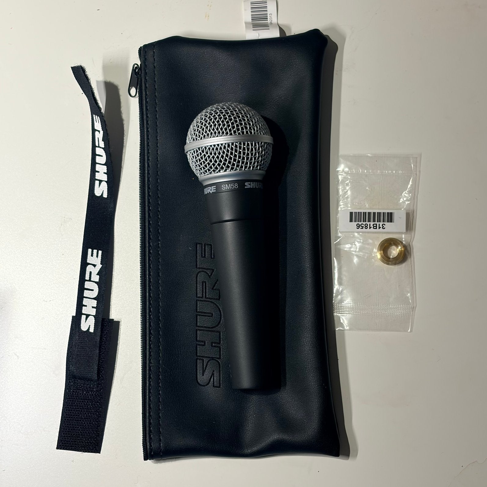 Shure SM58 zangmicrofoon - nieuw en ongebruikt, Handtassen en Accessoires, Ophalen of Verzenden, Zo goed als nieuw