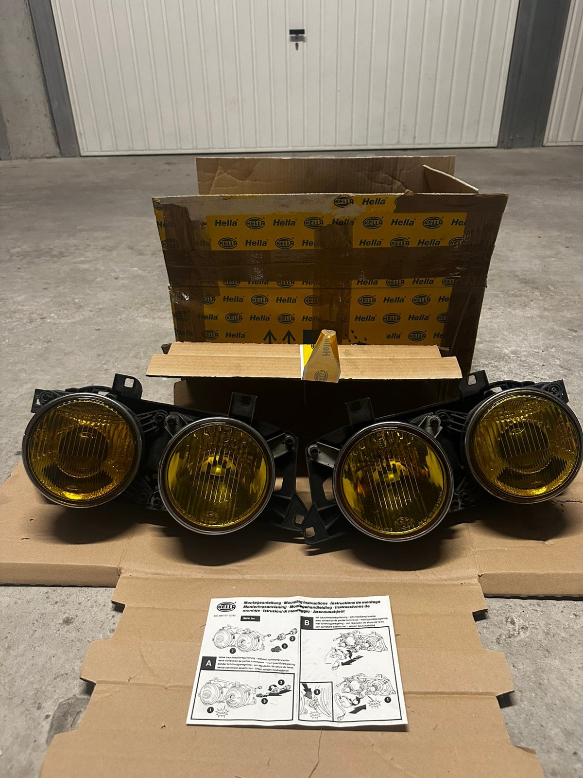 Originele Hella gele BMW E32 E34 koplamp in doos, Ophalen of Verzenden, BMW