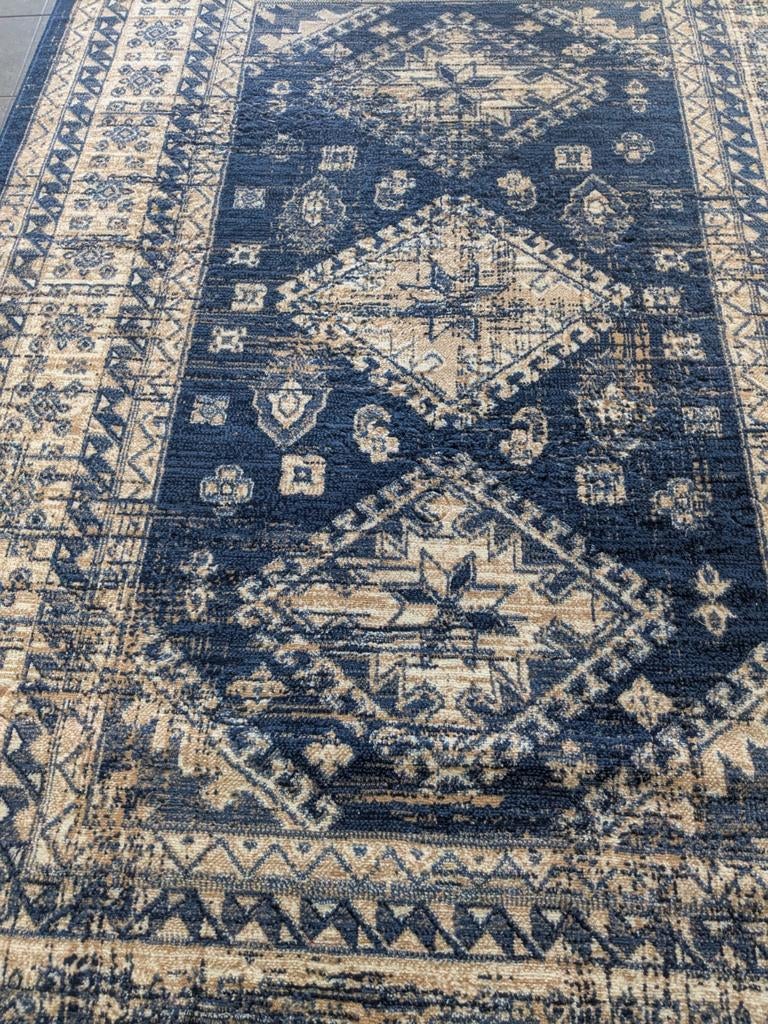 Grand tapis quasi neuf /Groot tapijt quasi nieuw, Enlèvement