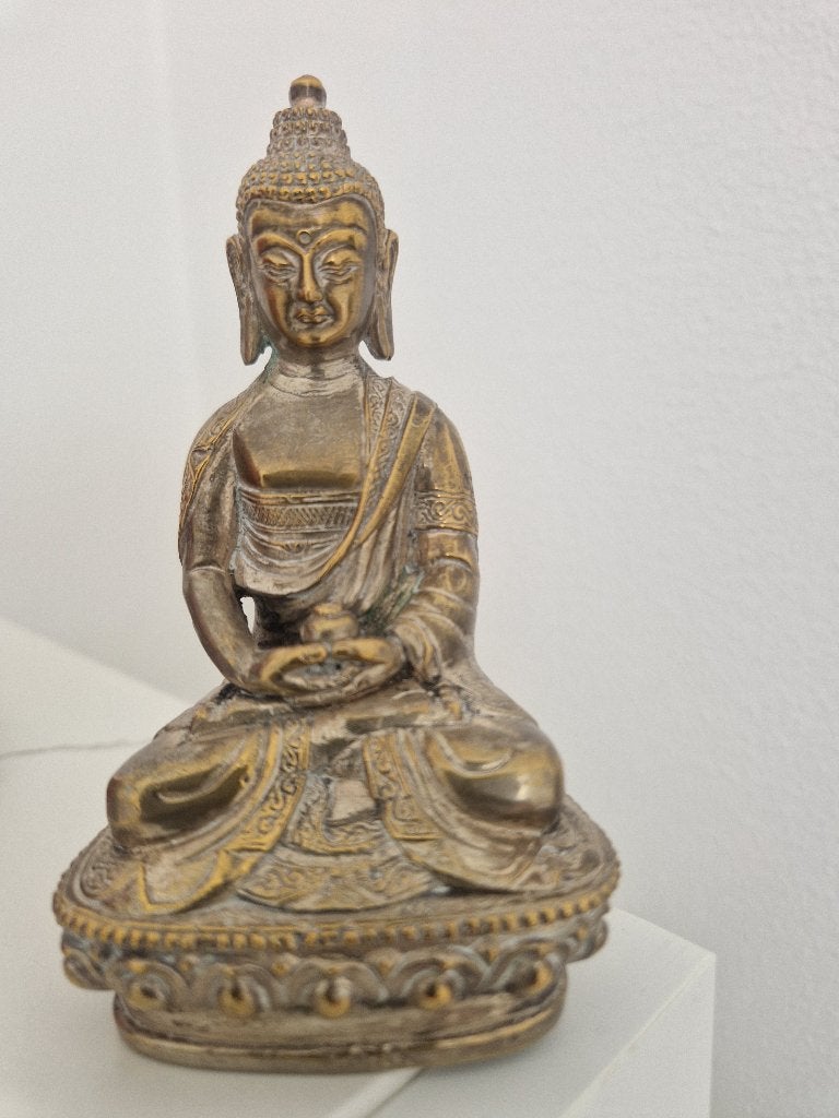 Oud bronzen Boeddha beeldje, Ophalen