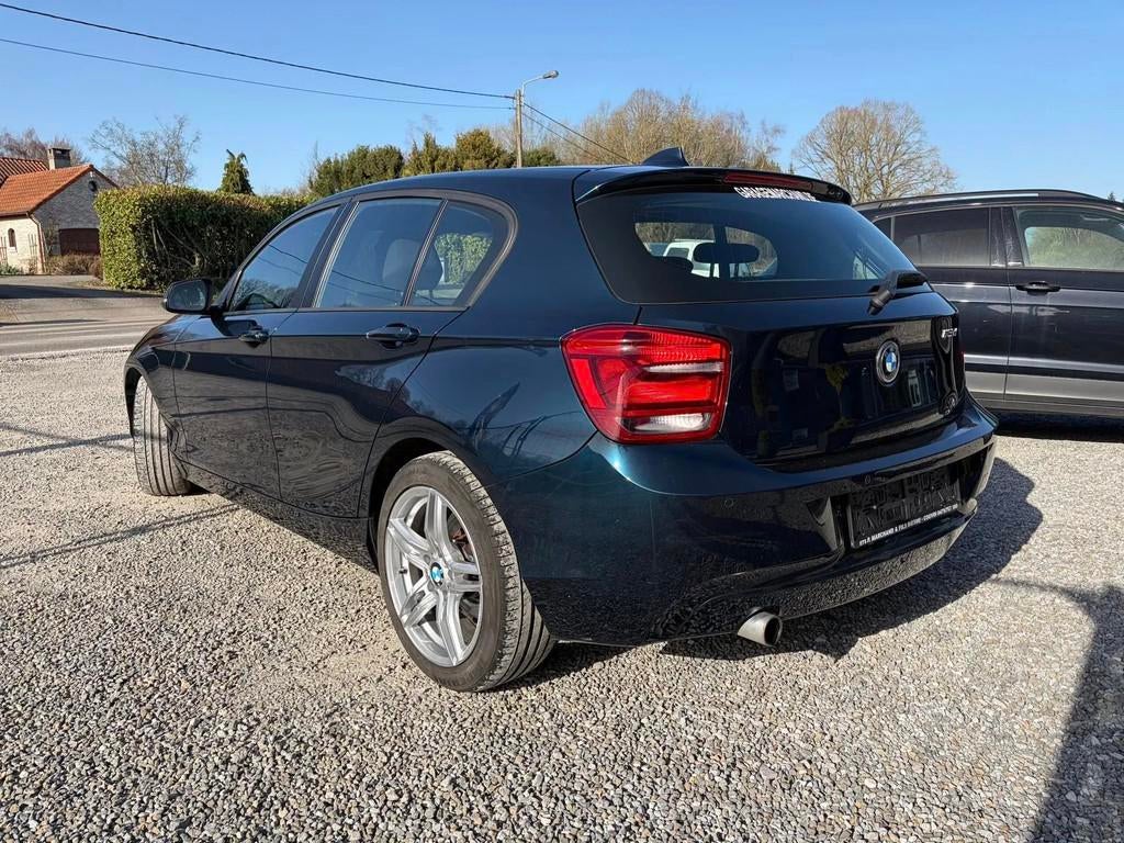 BMW 1 Serie (bj 2014), Auto's, Gebruikt, 1600 cc, Zwart, Bedrijf