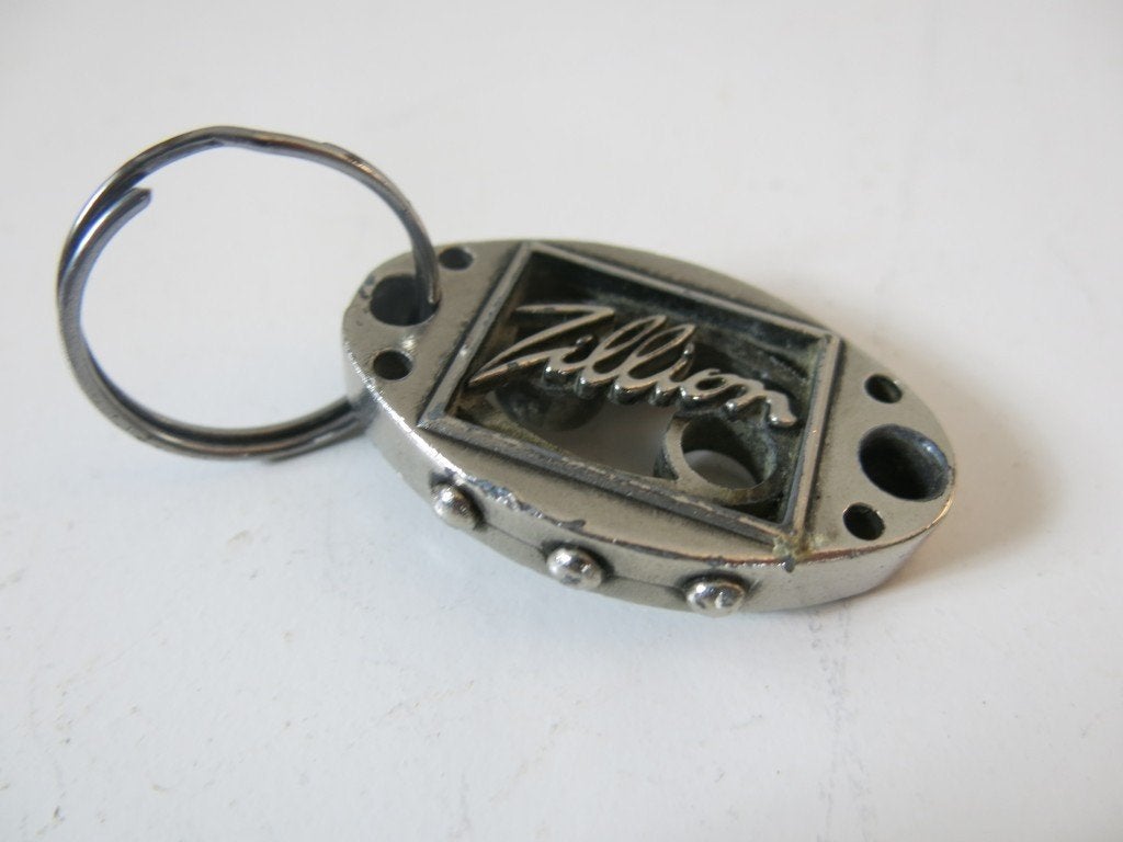 Originele metalen Zillion sleutelhanger, Verzamelen, Sleutelhangers, Ophalen of Verzenden, Gebruikt