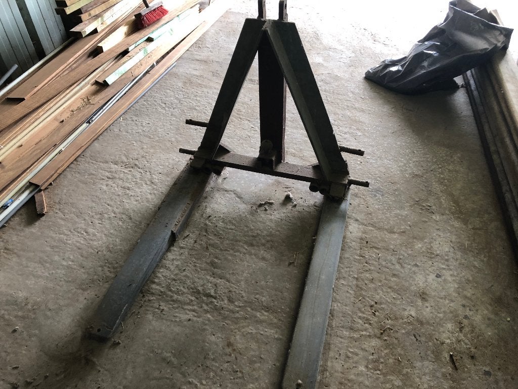 Palletvorken voor achteraan tractor, Ophalen