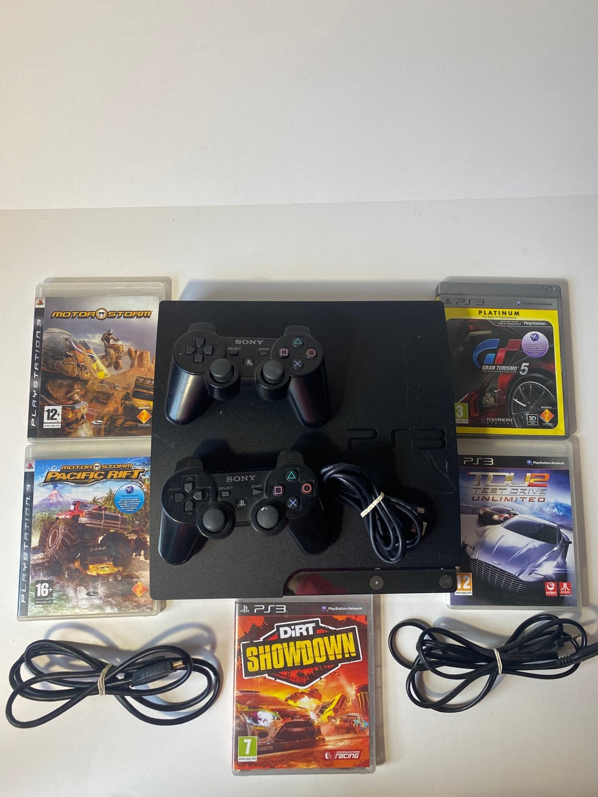 PlayStation 3 Slim met 2 controllers + 6 games + kabels, Games en Spelcomputers, Spelcomputers | Sony PlayStation 4, Zo goed als nieuw