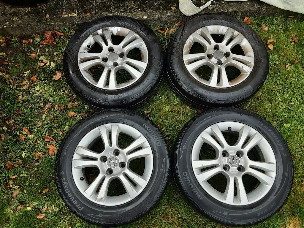 4 originele 15 inch wielen Opel Corsa D (4x100), Auto-onderdelen, Overige Auto-onderdelen, Opel, Suzuki, Gebruikt, Ophalen