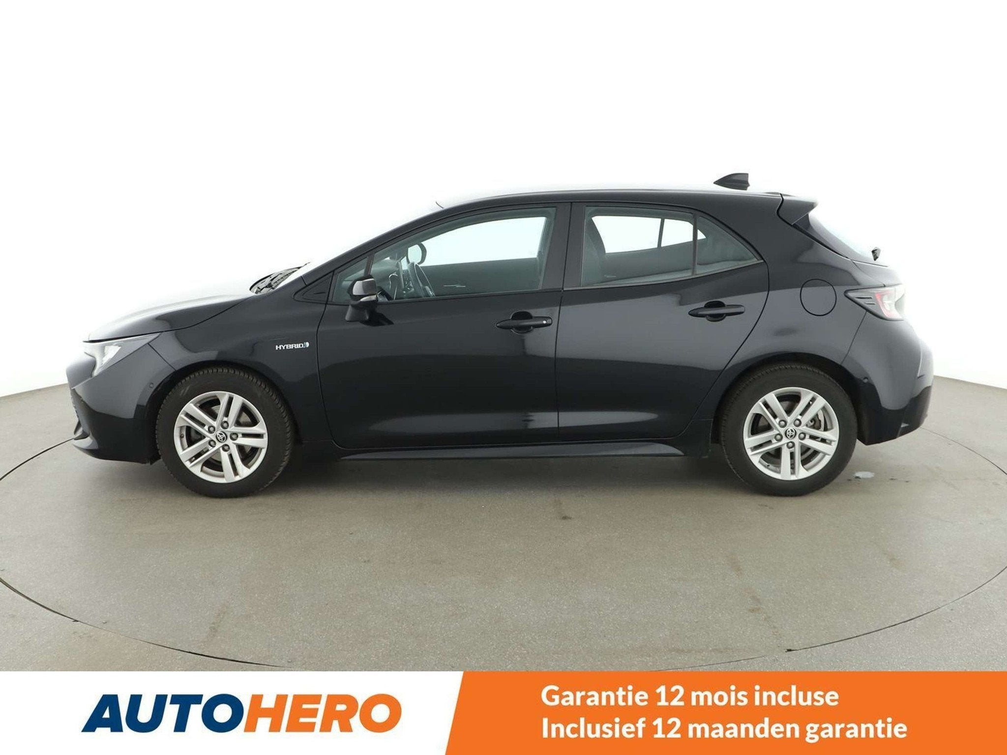 Toyota Corolla 1.8 Hybrid Comfort (bj 2020, automaat), Auto's, Gebruikt, Corolla, Zwart, Hybride Elektrisch/Benzine