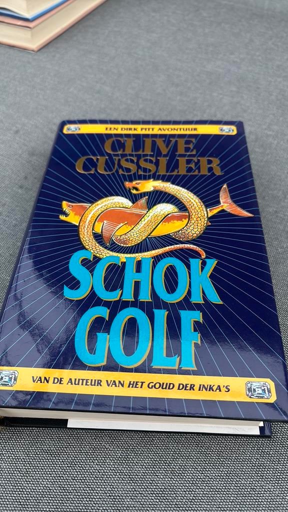 Clive Cussler - Schokgolf, Boeken, Ophalen of Verzenden, Clive Cussler