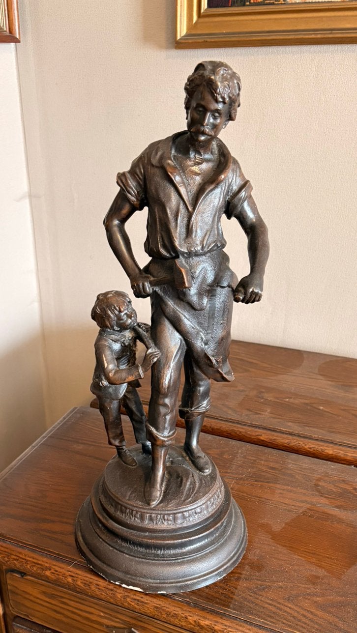 Beeld ambachtsman met jongentje, Ophalen, Brons