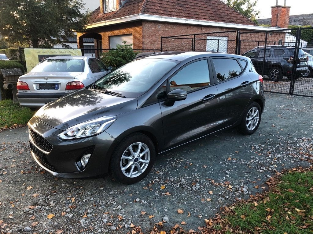 Ford Fiesta 1100 benzine 2021 met 55750 km, Autos, Argent ou Gris, Achat, Euro 6, Garantie prolongée