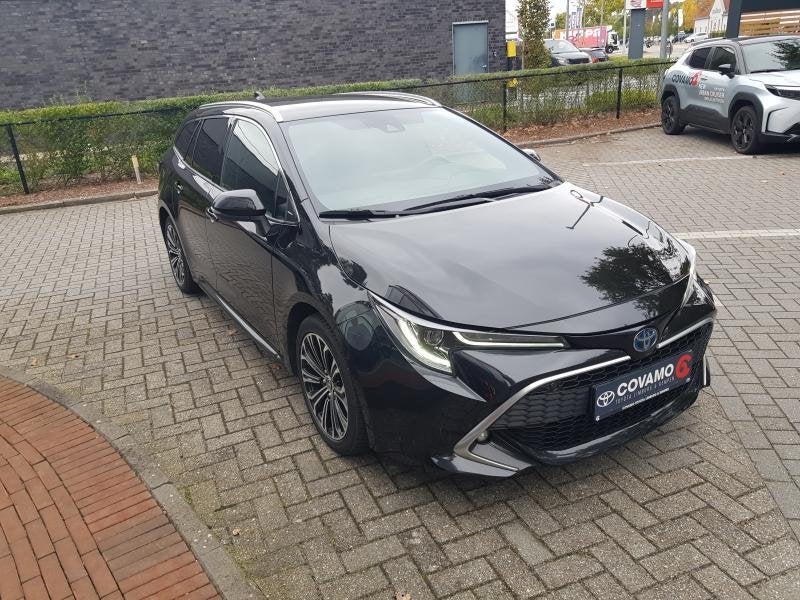 Toyota Corolla Premium 1.8HEV, Auto's, Automaat, 72 kW, Corolla, Zwart