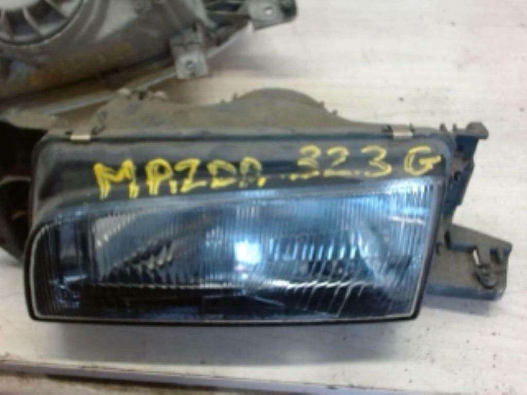 Optique avant principal gauche Mazda 323 I  (50703290), Autos : Pièces & Accessoires, Éclairage, Mazda, Utilisé, Enlèvement ou Envoi