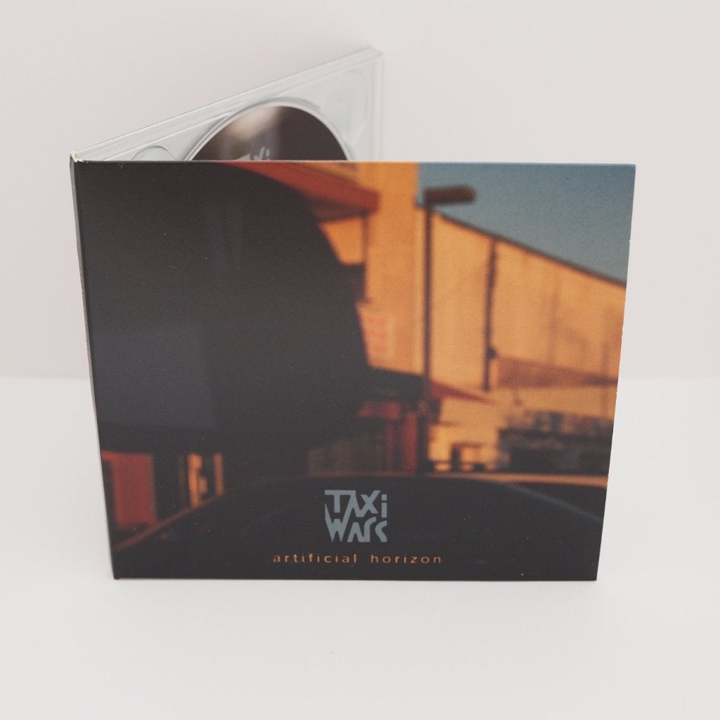 CD Taxi Wars - Artificial horizon, Cd's en Dvd's, Cd's | Jazz en Blues, Ophalen, Gebruikt, Inclusief boekje, Jazz