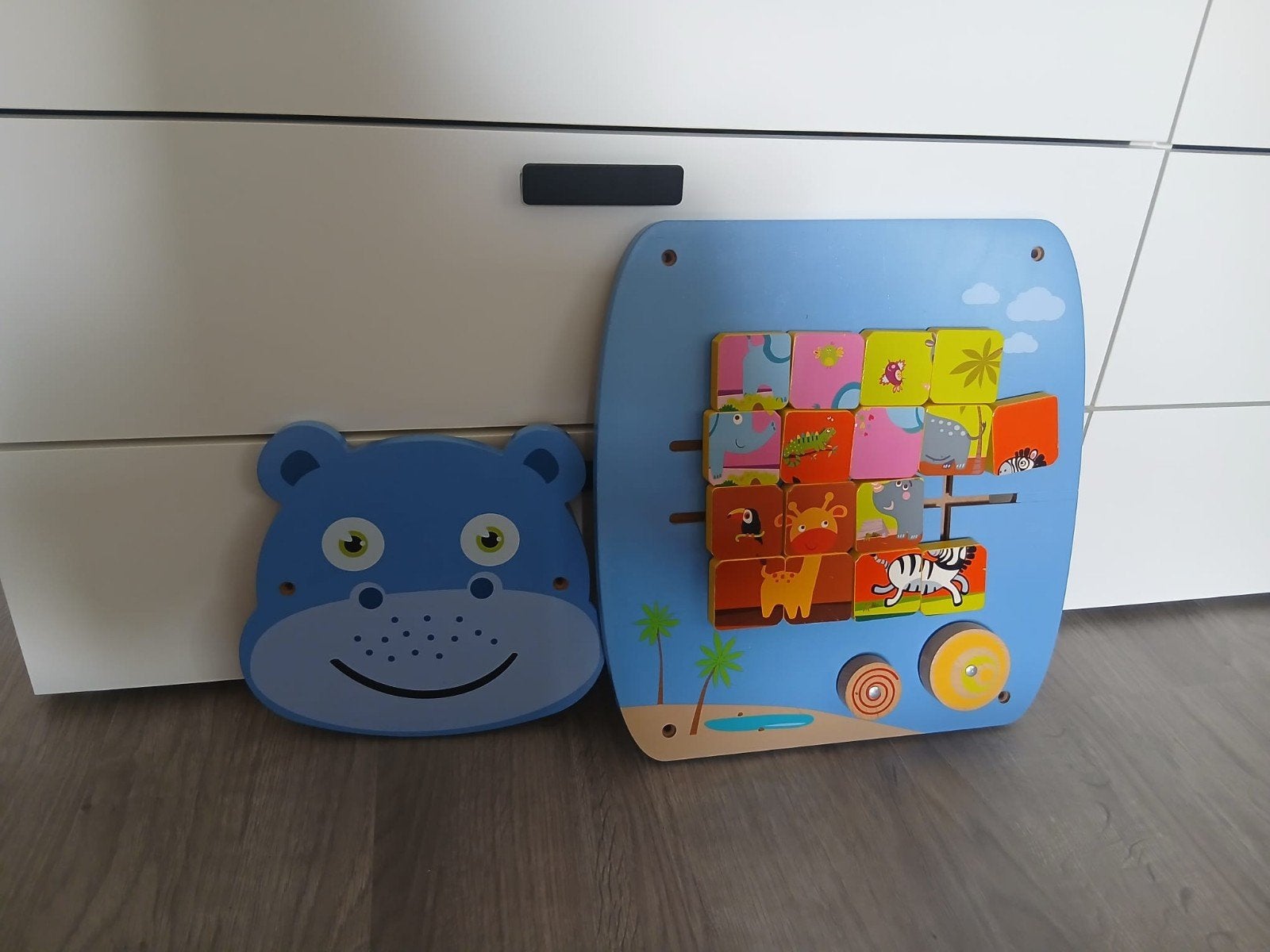 Houten speel paneel, Ophalen