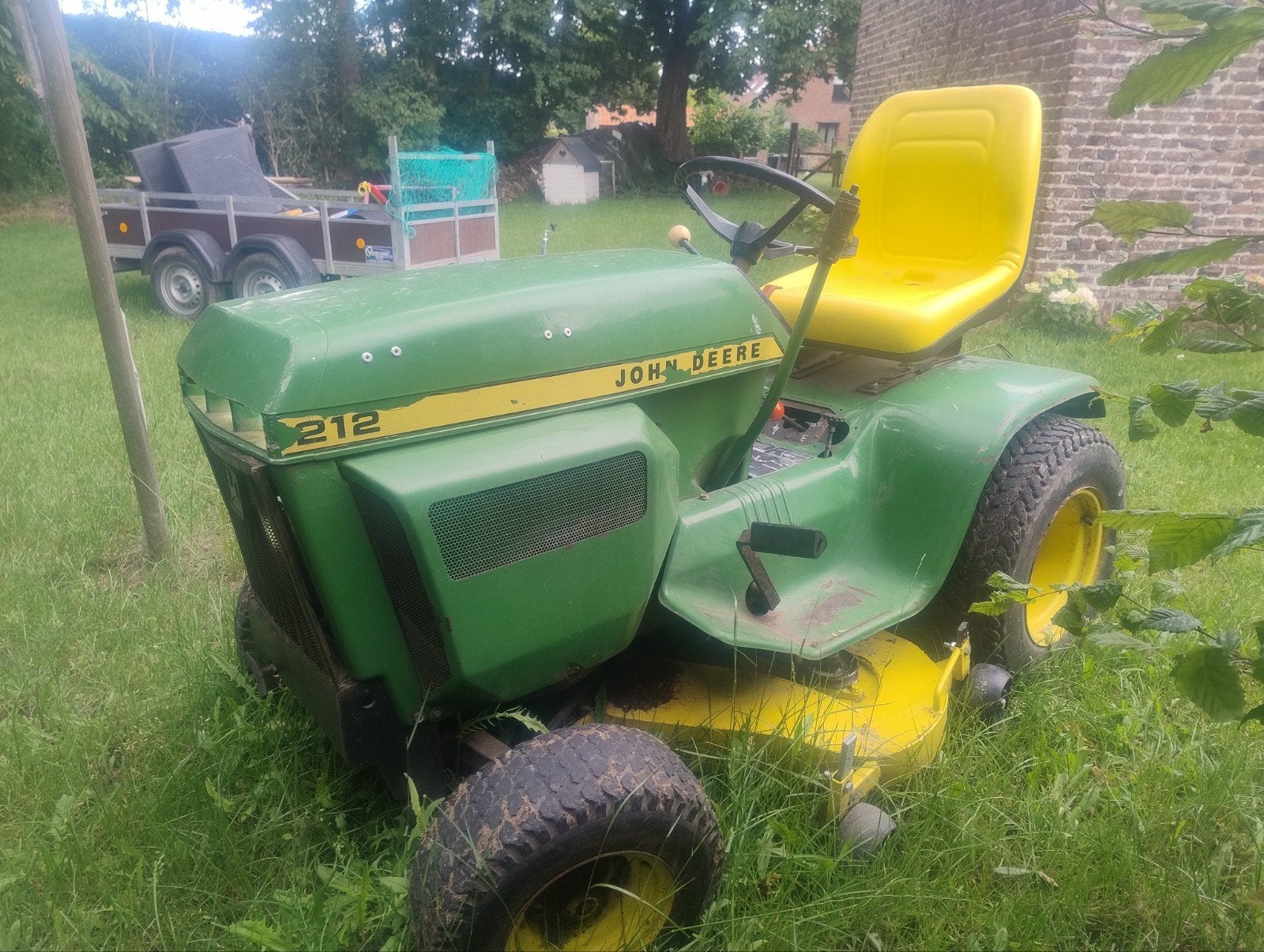 John Deere 212 met Inox maaidek, Ophalen