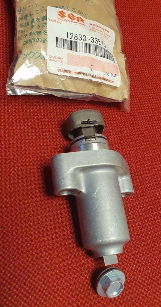 Nokkenas kettingspanner GSXR SRAD 600(750) 12830-33E13 Nieuw, Verzenden