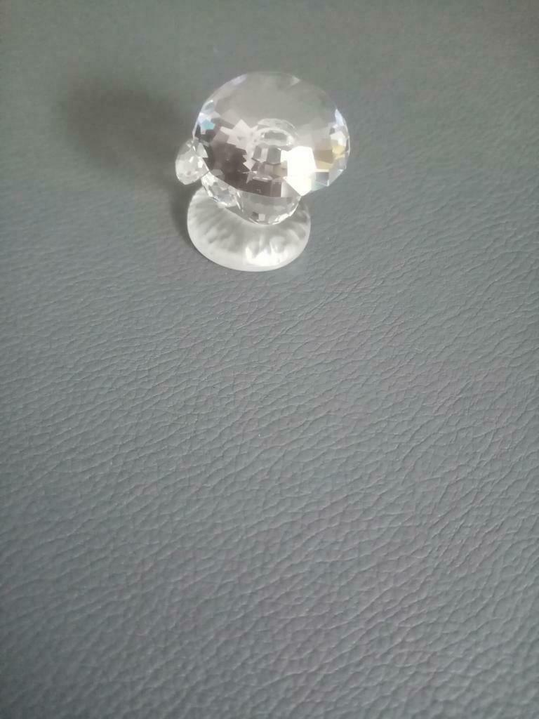 Swarovski kristal paddenstoel, Ophalen