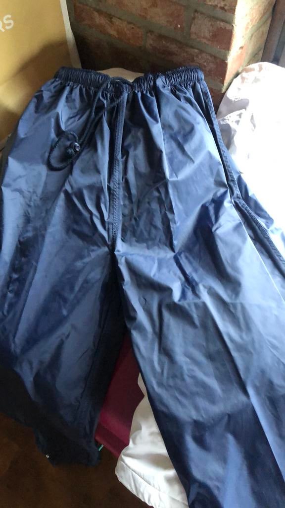 Ski/regenboroek blauw, maat L en nieuw, Caravans en Kamperen, Regenkleding, Ophalen of Verzenden, Zo goed als nieuw, Regenbroek