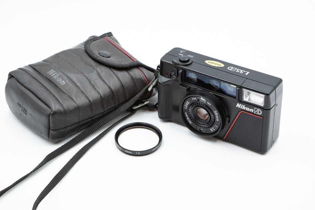 Nikon L35AF (ISO 1000) - 35mm f/2.8 + Sangle/Sacoche/Filtre, Enlèvement ou Envoi, Utilisé, Compact, Nikon
