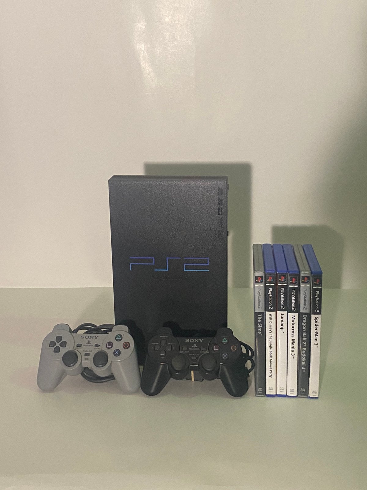 PlayStation 2 + 2 manettes originales + 7 jeux + câbles, Enlèvement ou Envoi, Phat, Comme neuf, Avec jeux
