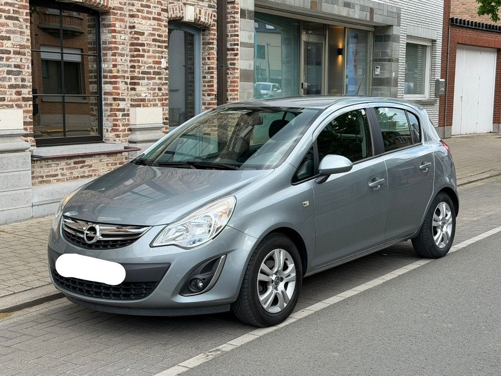 Opel Corsa 2012 benzine 37000km Airco Cruise control, Auto's, Euro 5, 5 deurs, Particulier, Zilver of Grijs