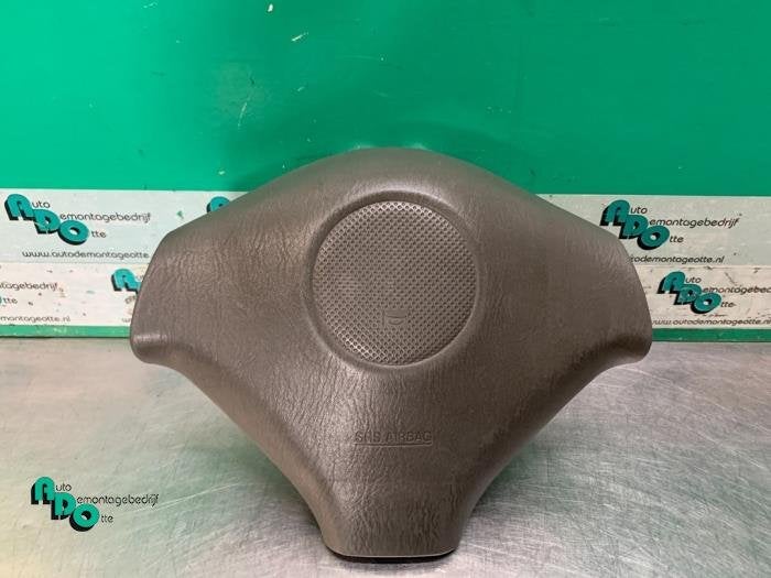 Airbag gauche (volant) d'un Suzuki Ignis (Ignis J. 99-), -, 3 mois de garantie, Utilisé, -