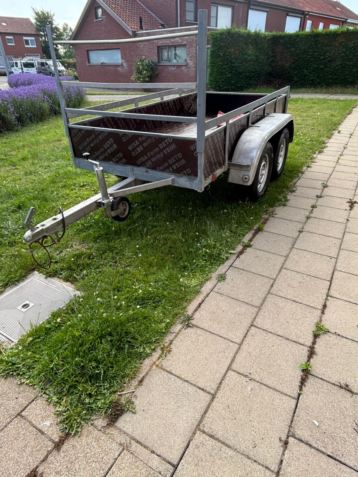Dubbelas aanhnagwagen met zeil, Ophalen