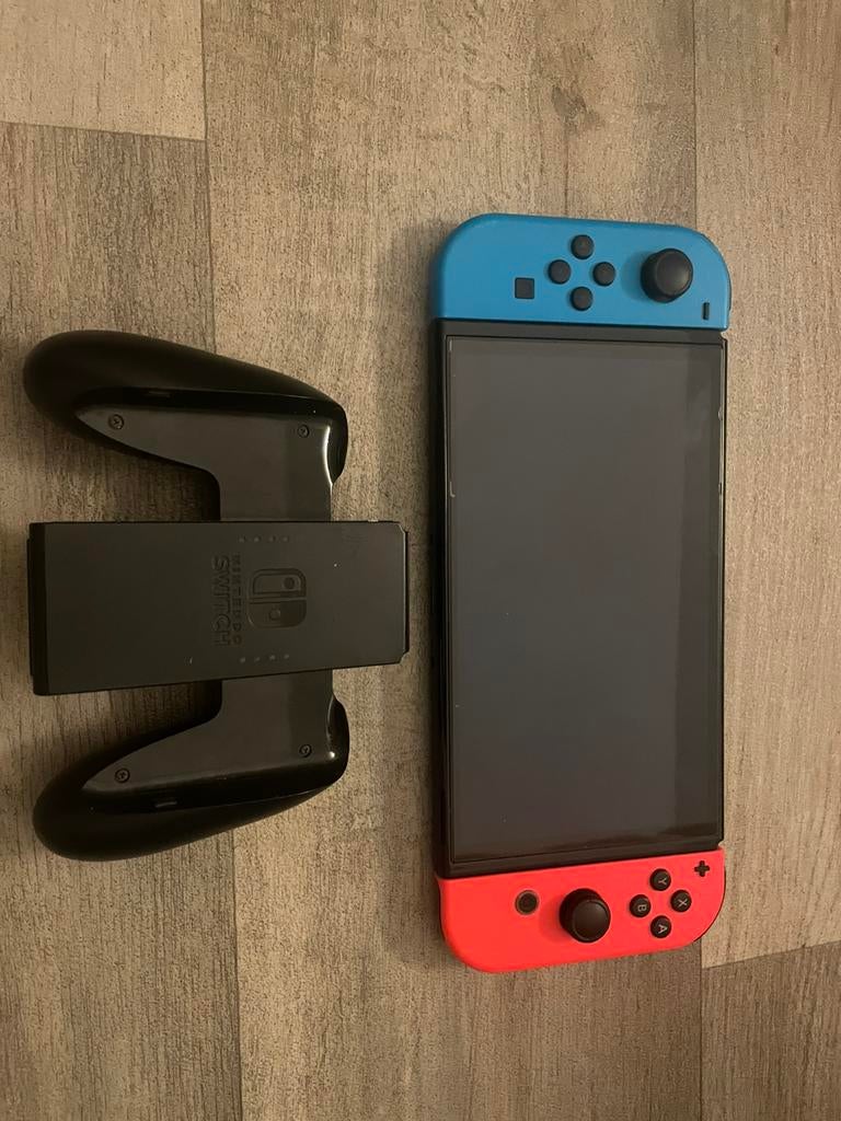 Nintendo Switch, Ophalen of Verzenden, Zo goed als nieuw, Switch OLED, Met games