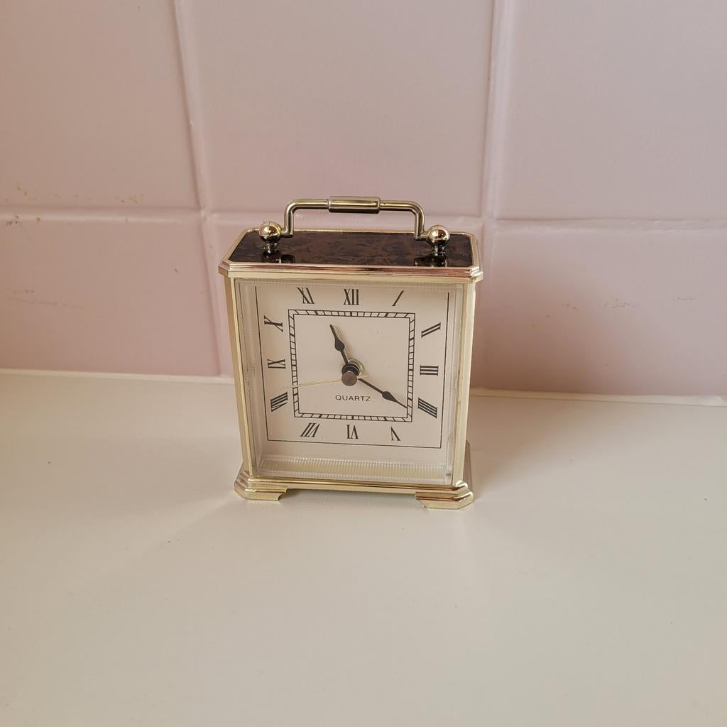 reisklok quartz  goudkleurig, Ophalen