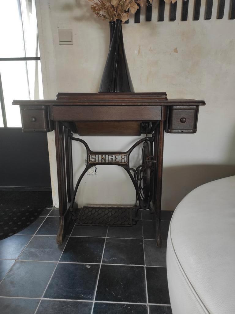 Antieke singer naaimachine, Ophalen