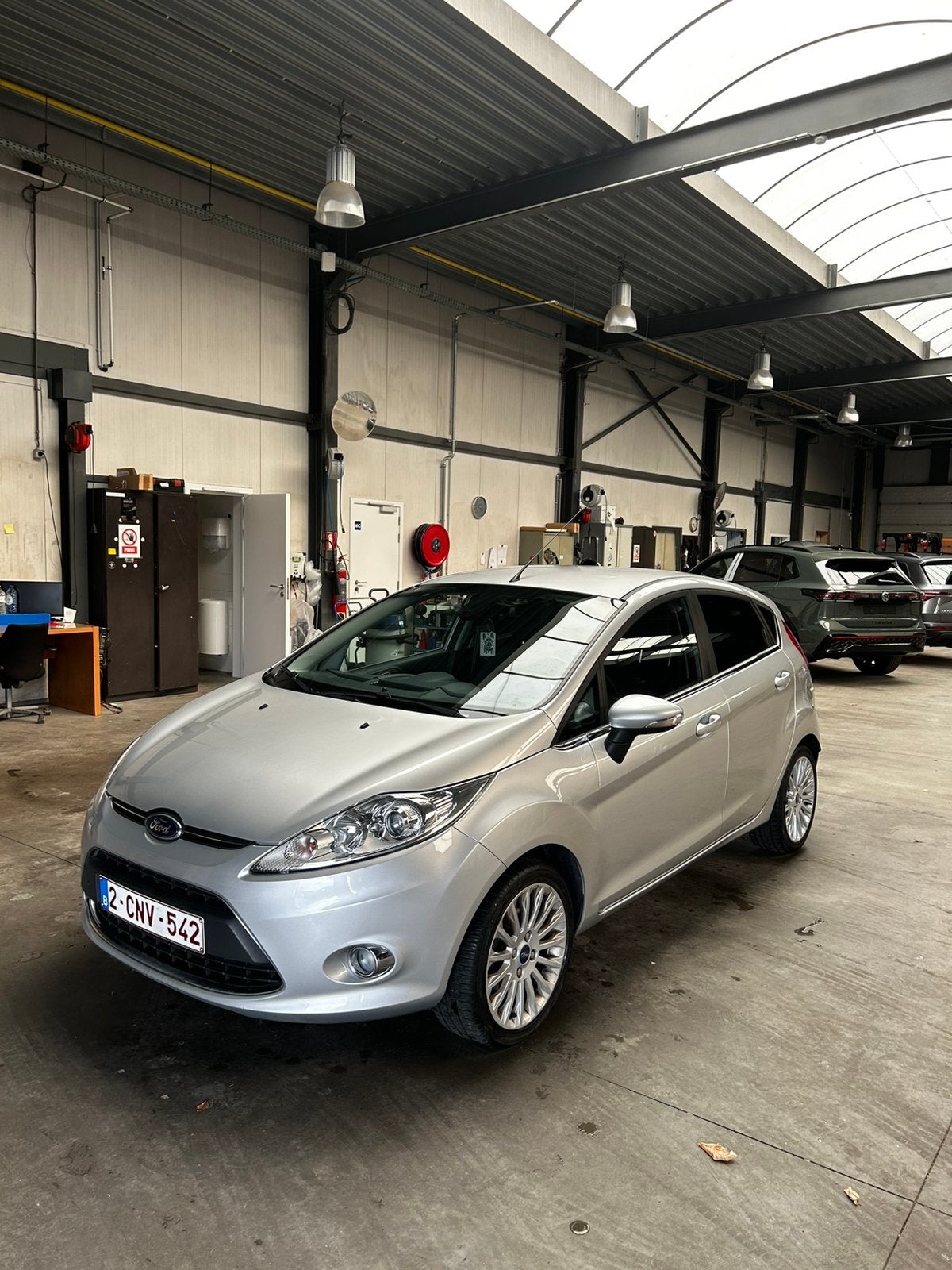 TOPOCCASIE FORD FIESTA 1.25i, Auto's, Voorwielaandrijving, Multifunctioneel stuurwiel, Stof, Zwart