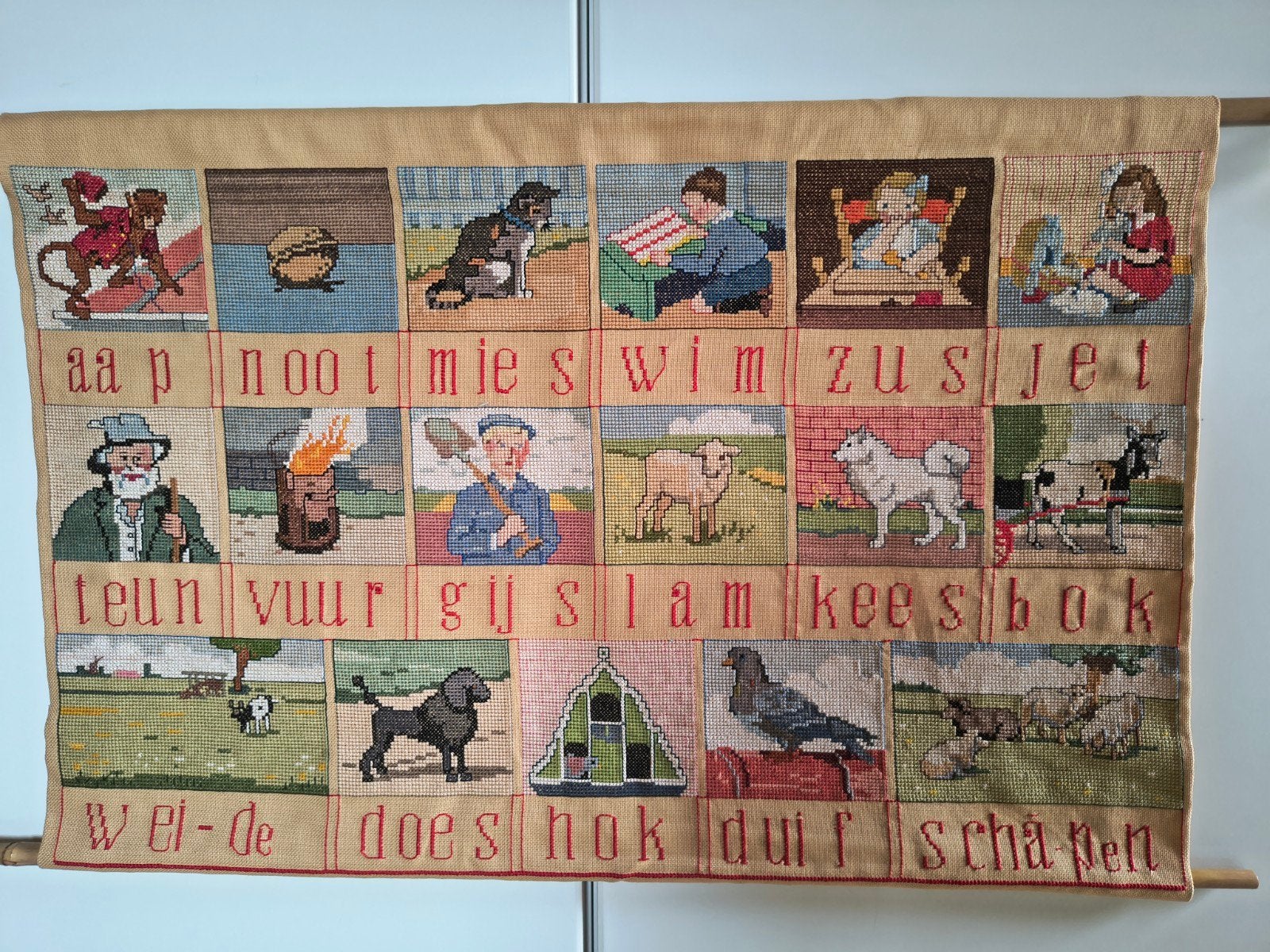 leesplankje Aap Noot Mies in kruisjessteek, Ophalen