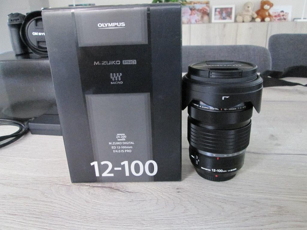 Olympus / Lumix LENS 12 - 100 F.4  PRO, Audio, Tv en Foto, Ophalen of Verzenden, Nieuw, Telelens, Zoom