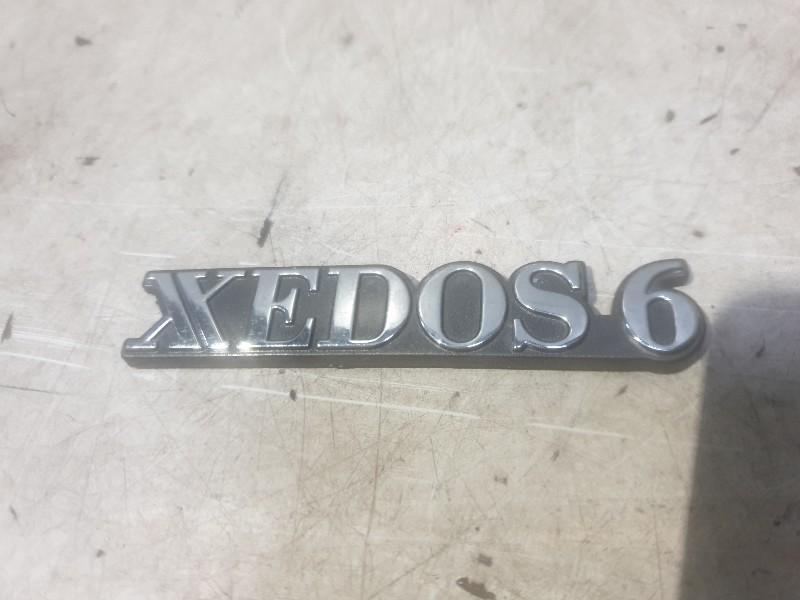 EMBLEEM Mazda Xedos 6 (01-1992/01-1999), Auto-onderdelen, Overige Auto-onderdelen, Mazda, Gebruikt