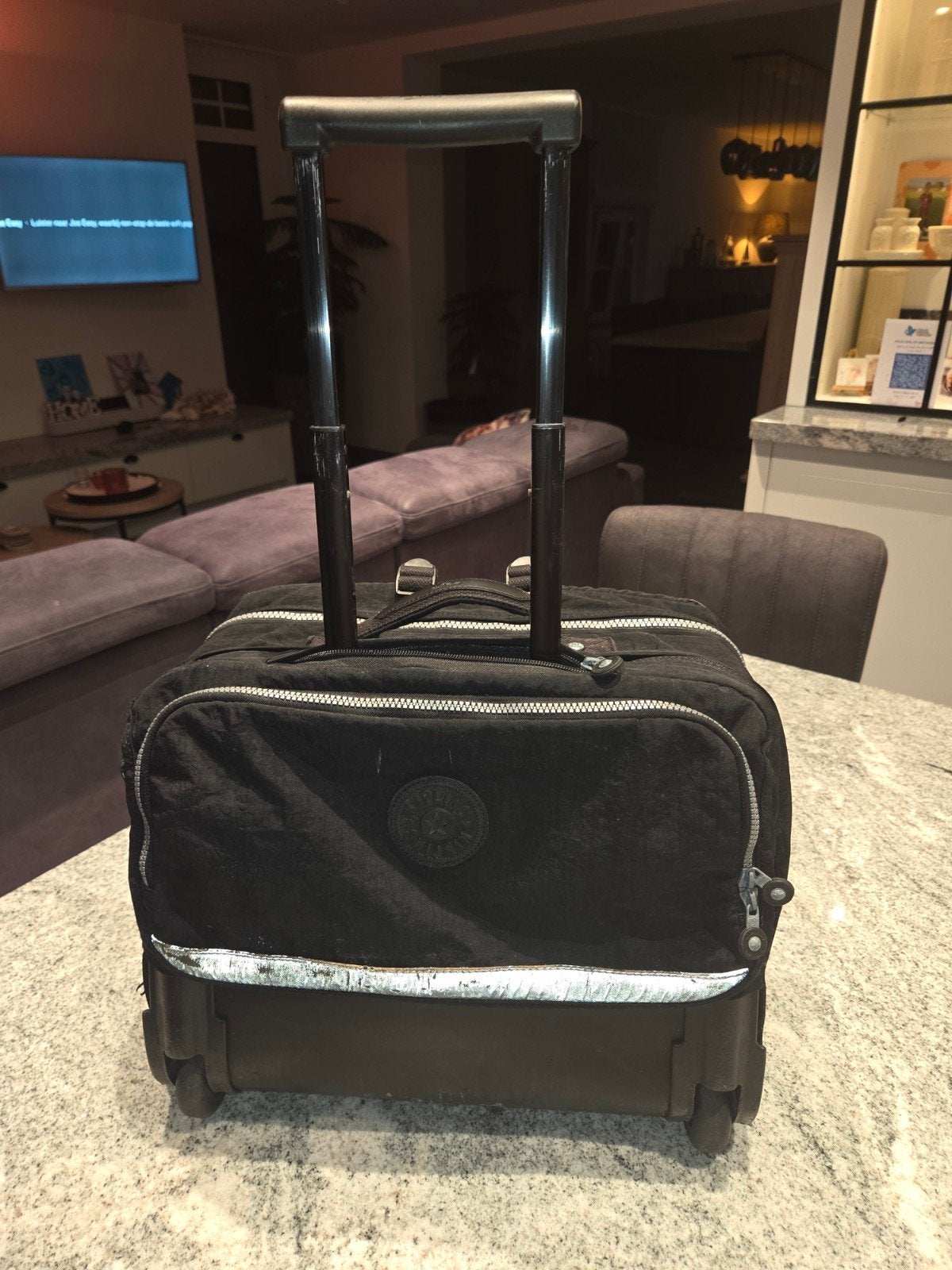 Kipling trolley boekentas, Enlèvement, Poignée