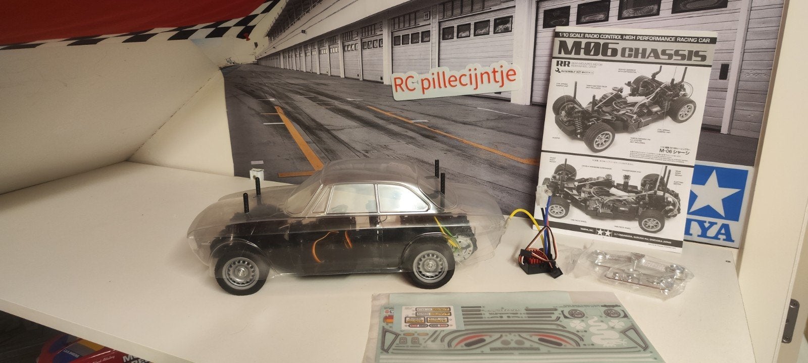 tamiya M06 alfa Romeo Nieuw 

nieuw gebouwd komt met motor,s, Hobby en Vrije tijd, Ophalen of Verzenden
