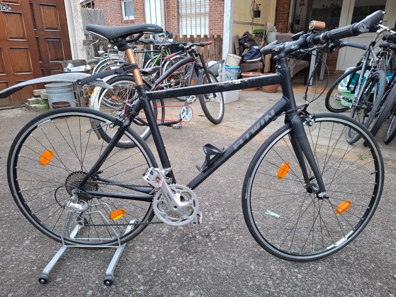 koersfiets met recht stuur van btwin, Ophalen