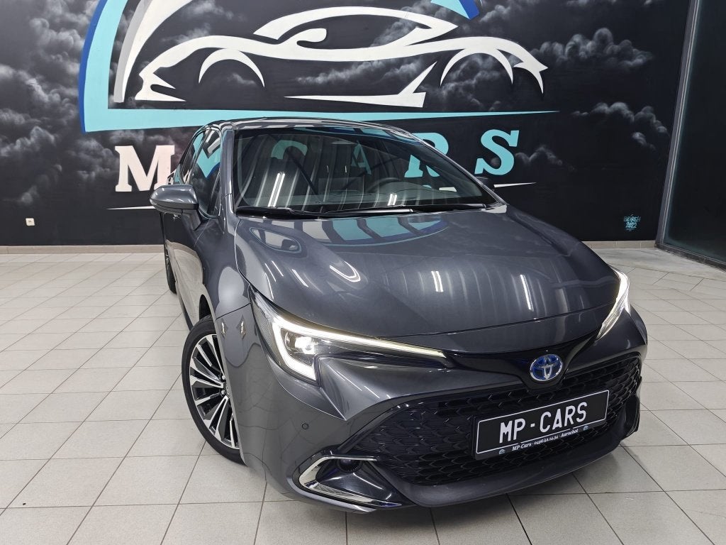 Toyota Corolla 1.8 Hybrid Style + tech pack, Auto's, Toyota, Berline, 5 deurs, Zilver of Grijs, Te koop