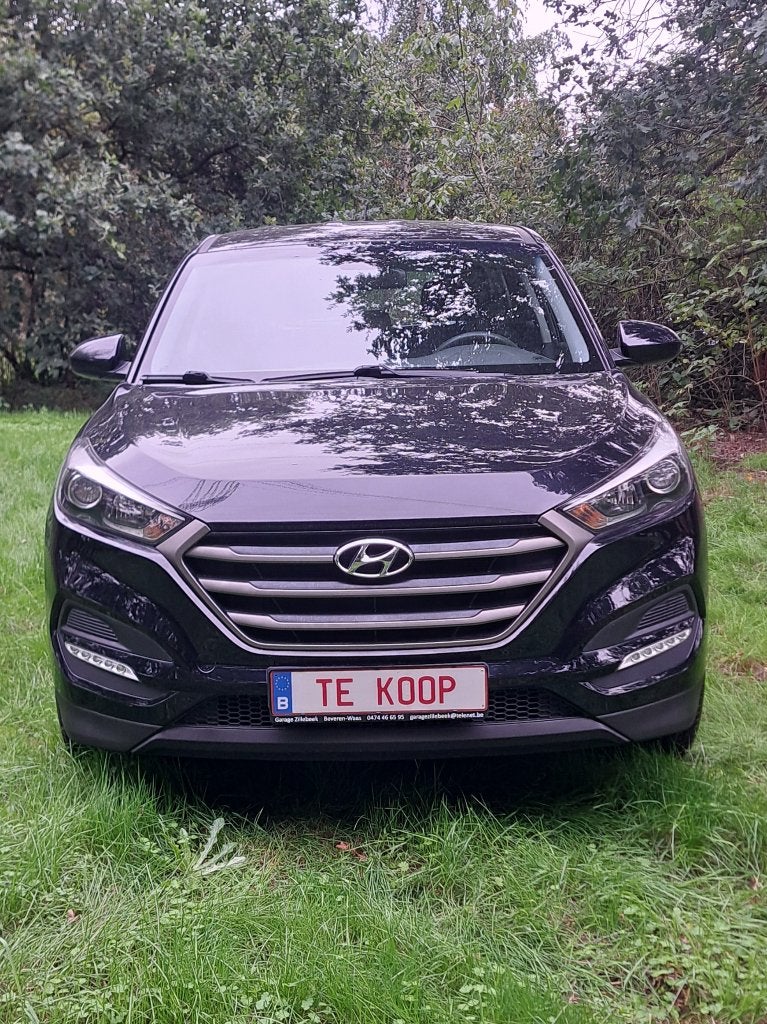 Hyundai Tucson: 59.000km + airco +garantie + groot nazicht!, Voorwielaandrijving, Stof, 4 cilinders, Zwart