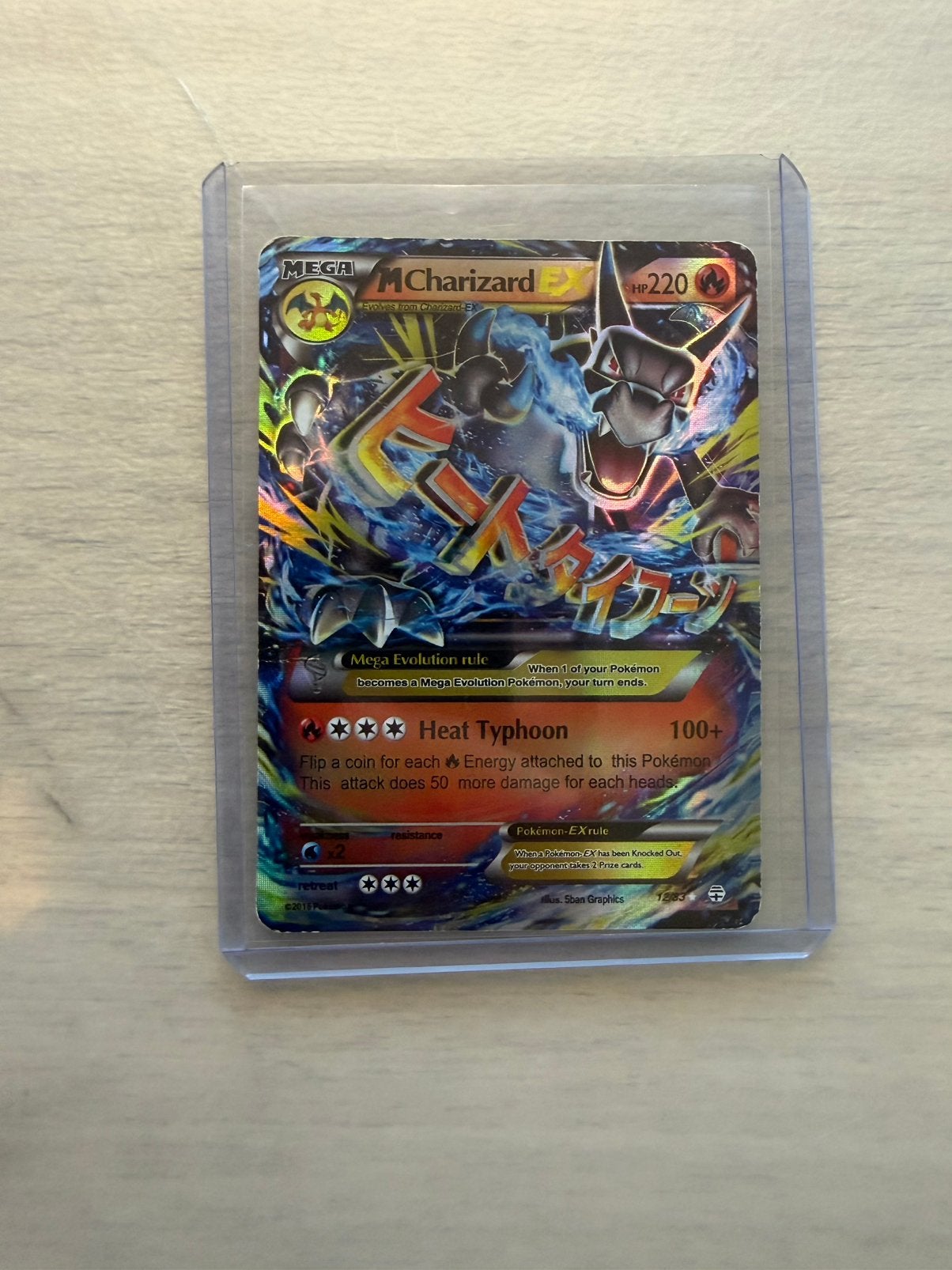 M charizard ex 12/83, Ophalen of Verzenden, Zo goed als nieuw
