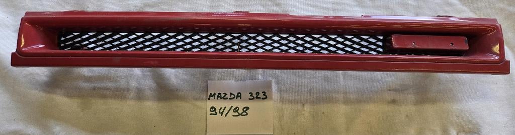 Calandre Mazda 323 94/98, Pare-chocs, Utilisé, Avant, Enlèvement