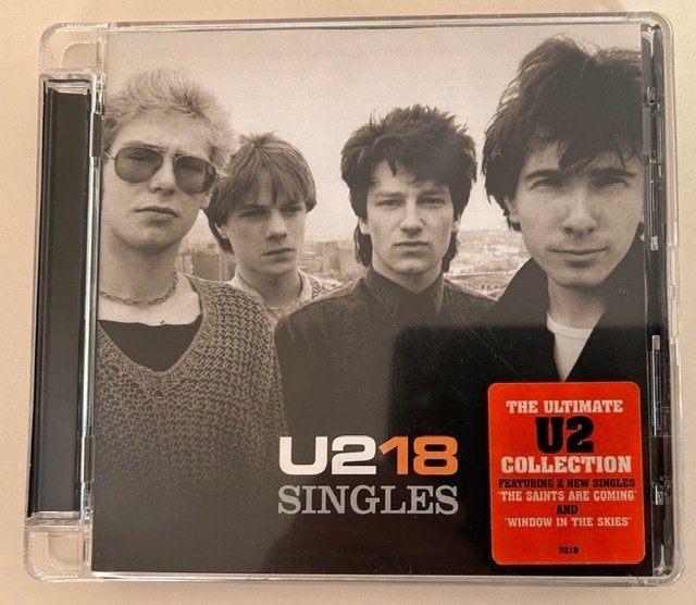 CD U2 - 18 SINGLES - BONO - THE EDGE, Pop rock, Enlèvement ou Envoi, Comme neuf, Compilation