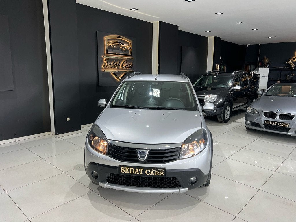 Dacia Sandero STEPWAY 1.6 BENZINE EURO 5, Auto's, Euro 5, Stof, Zwart, 62 kW