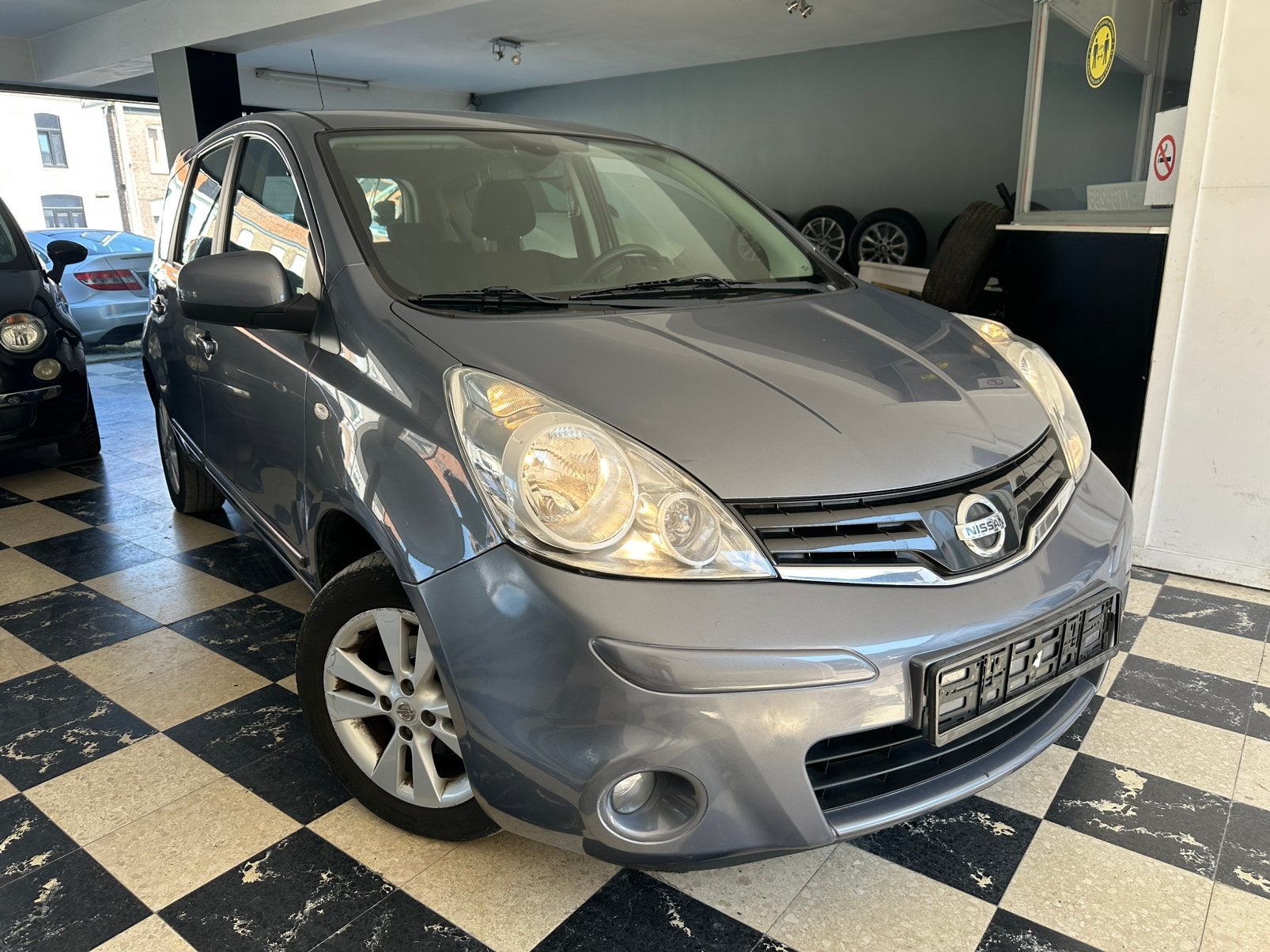 Nissan Note 1.4i | Navigatie | Airco | Parkeersensoren, Auto's, Nissan, Voorwielaandrijving, Stof, 139 g/km, Zwart