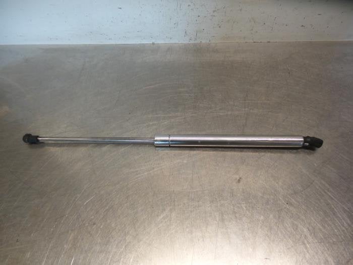 Amortisseur capot moteur gauche d'un Volkswagen Polo (Polo 0, Volkswagen, -, 3 mois de garantie, Utilisé