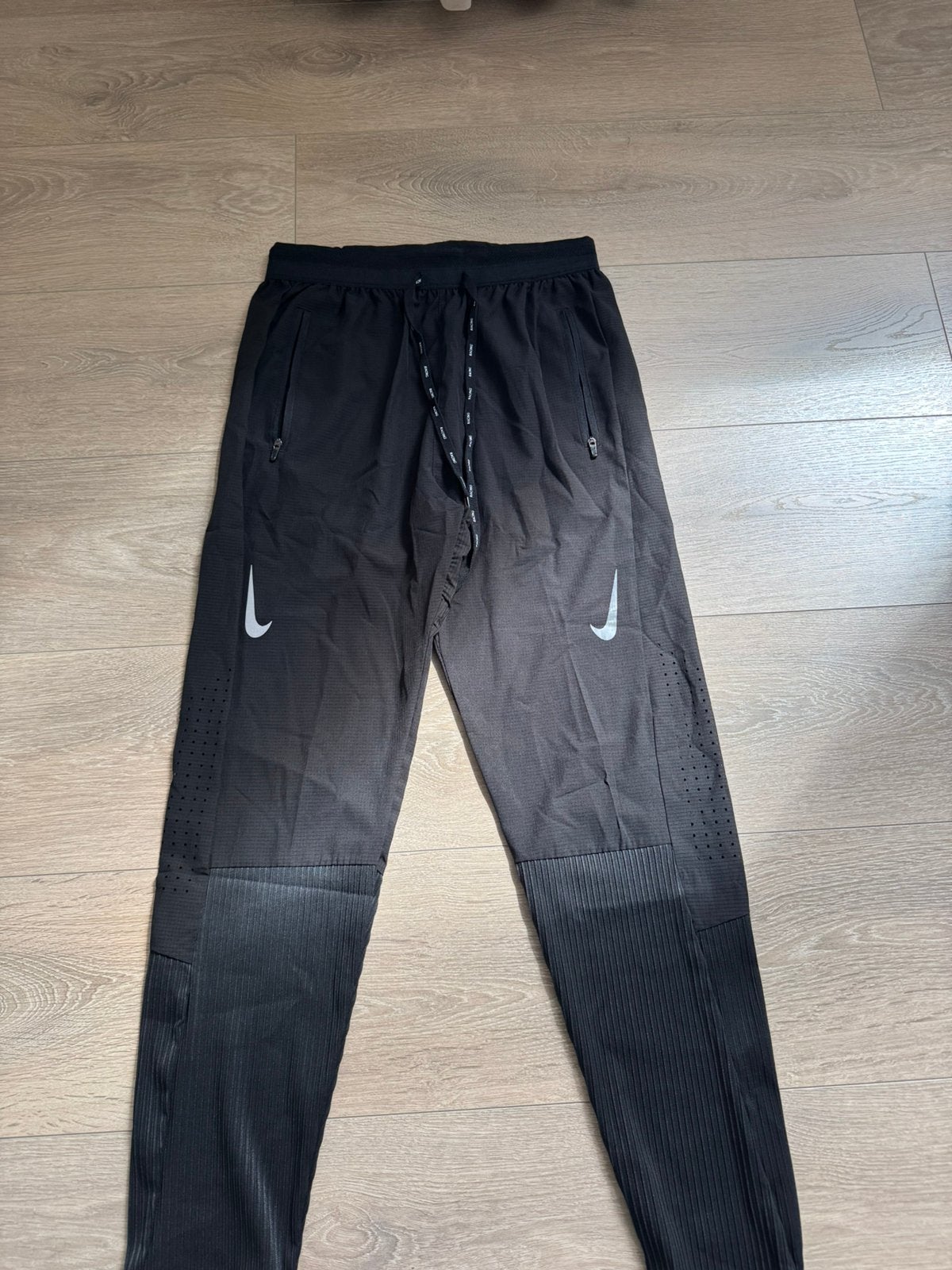 Nike racing broek, Sport en Fitness, Loopsport en Atletiek, Ophalen, Nieuw