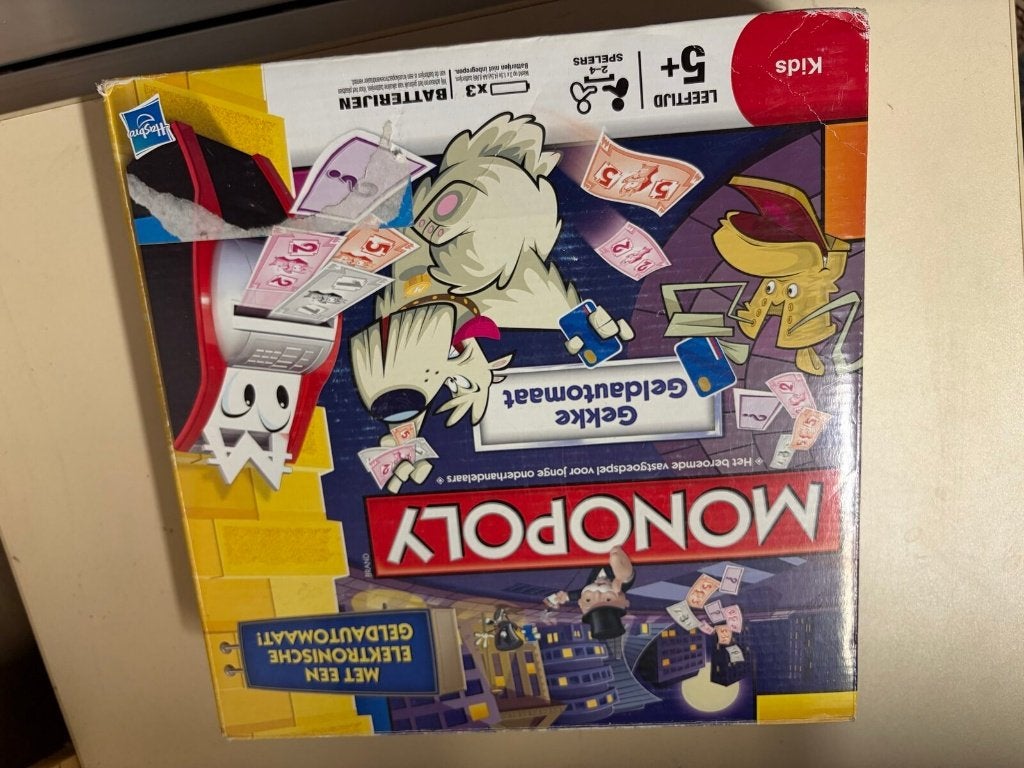 Monopoly Junior "Gekke Geldautomaat" (Hasbro) — werkend, Hobby en Vrije tijd, Ophalen of Verzenden