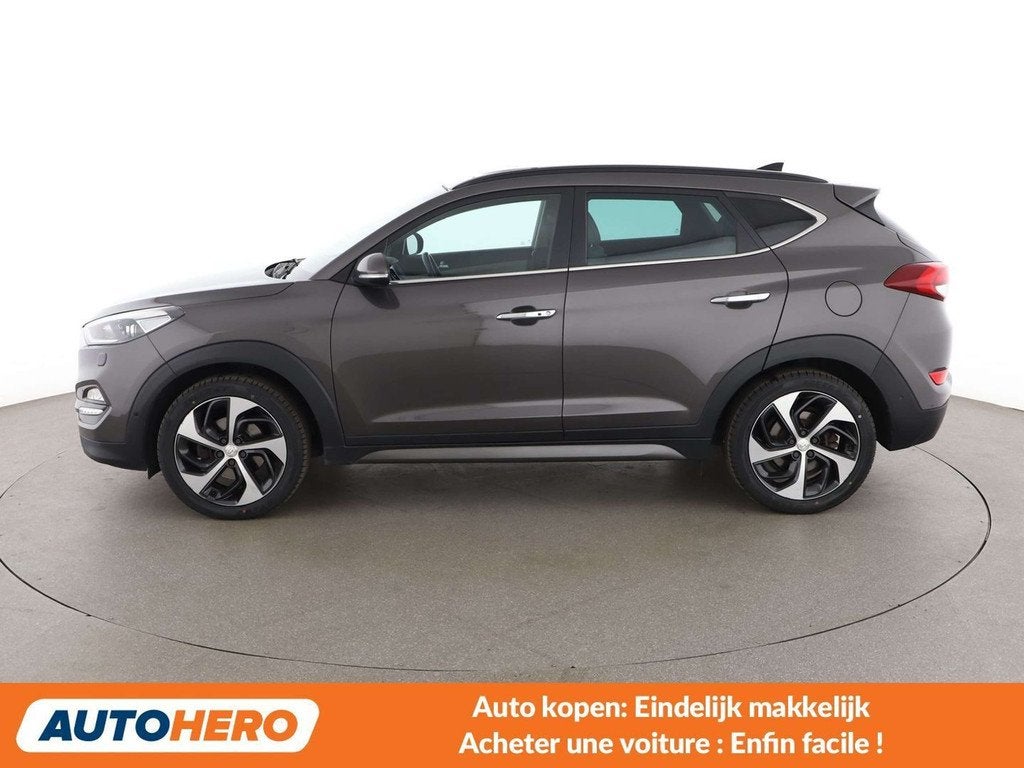 Hyundai Tucson 1.6 TGDI Advantage 4WD (bj 2016, automaat), Auto's, Hyundai, Automaat, Gebruikt, Bruin, Leder