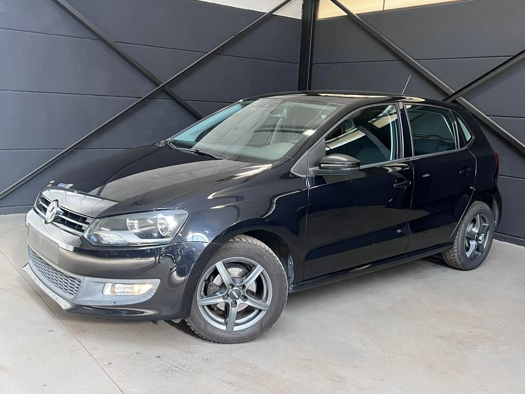 Vw Polo 1.2 benzine, bj2012, 133.000km, 1j garantie, Auto's, Euro 5, Stof, Zwart, Parkeersensor
